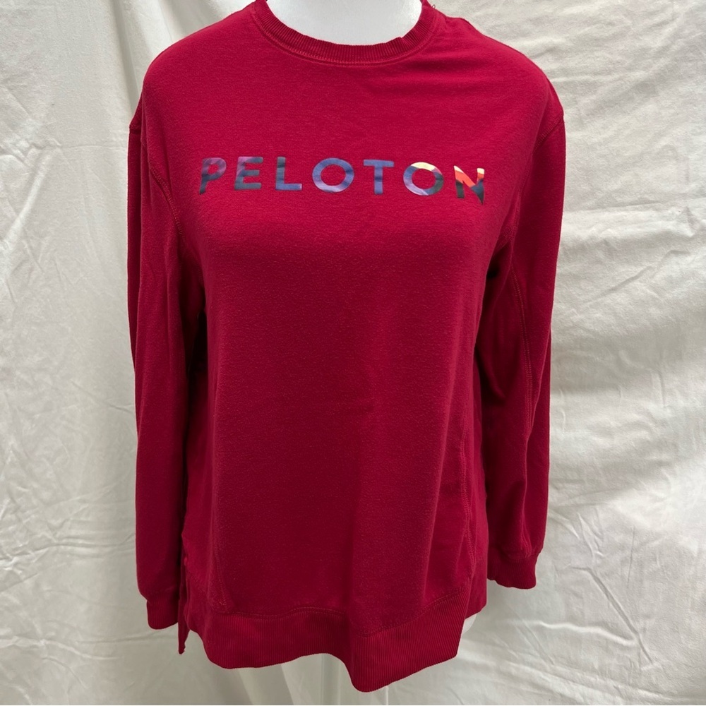 Peloton cranberry colored lightweight sweatshirt with multi-color brand name. - Picture 2 of 8